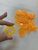 Пуговица пластик с буквами прозрачная в оранжевом цвете #1